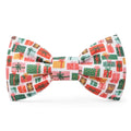 Christmas-themed bow tie with colorful presents on a white background