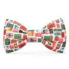 Christmas-themed bow tie with colorful presents on a white background
