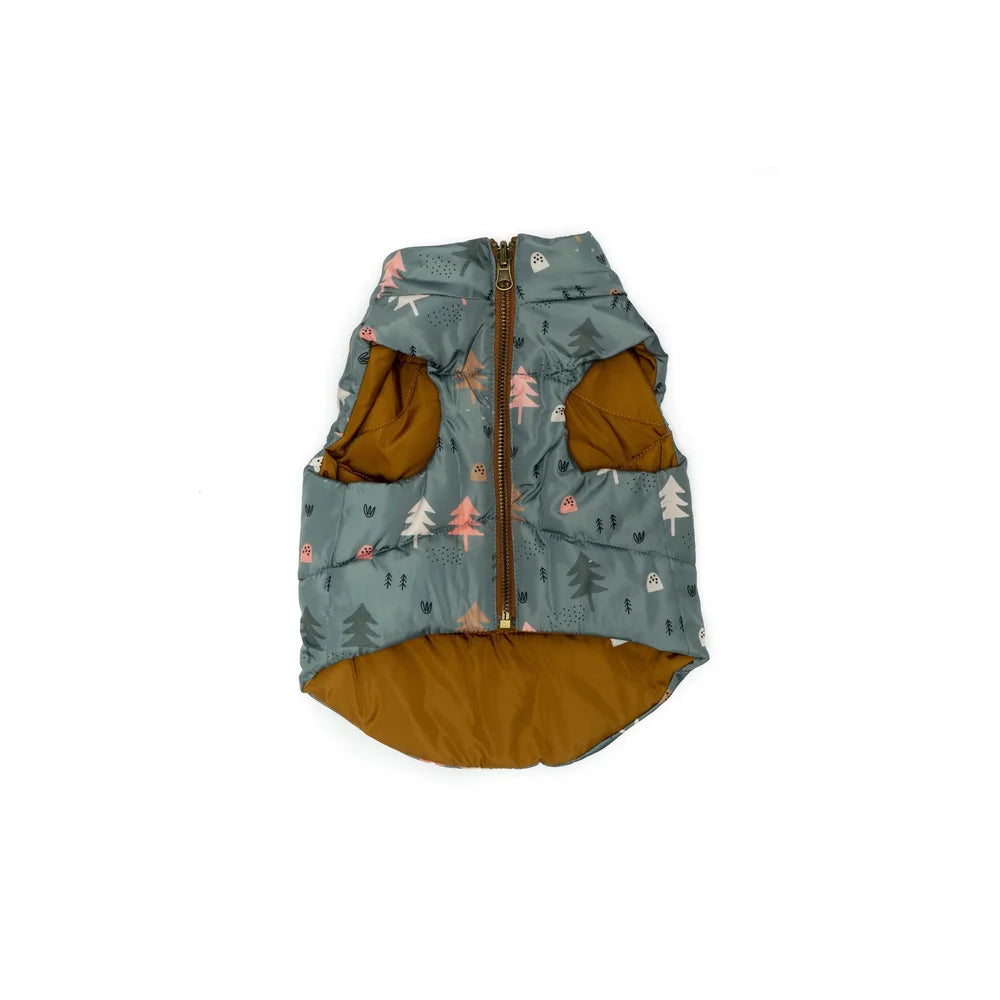 Dog puffer vest with forest pattern on a white background