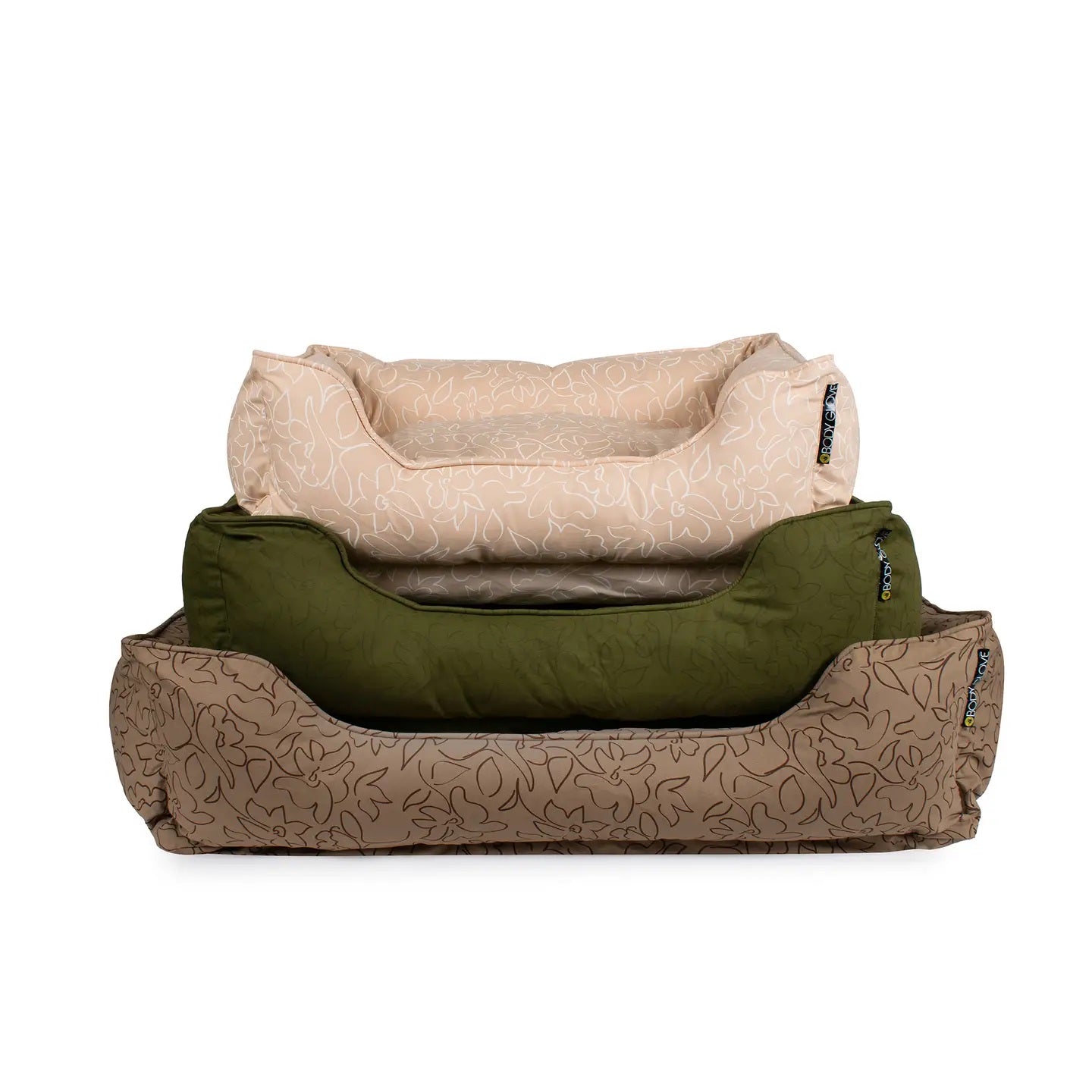 Three stacked patterned pet beds, one beige, one green and one brown on a white background.