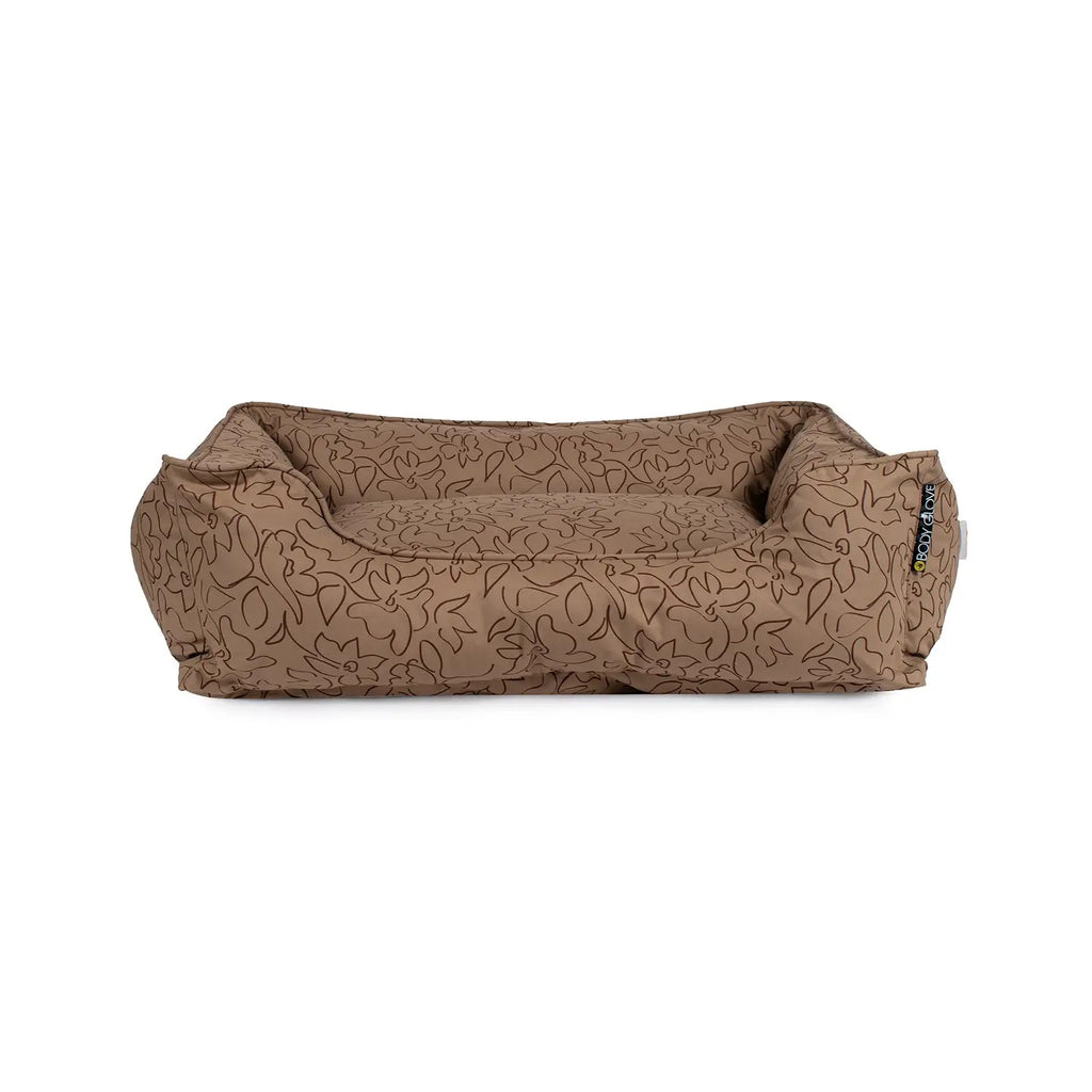 Brown patterned dog bed on a white background