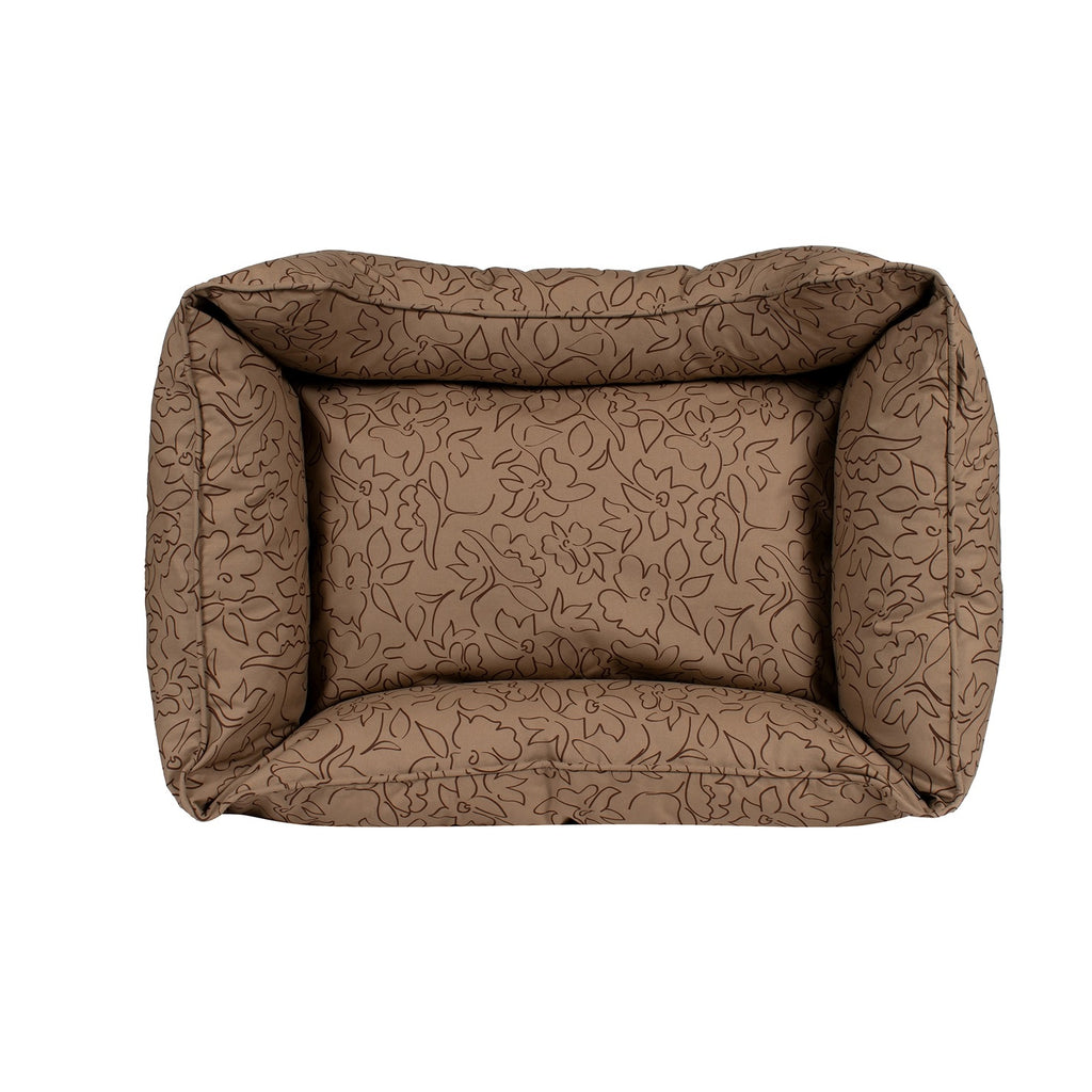 Brown patterned dog bed on a white background