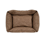 Brown patterned dog bed on a white background