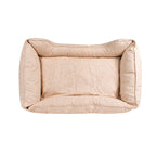 Beige dog kuddler bed with floral pattern on a white background