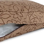 Brown patterned dog bed showing the interior on a white background