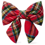 Plaid dog bow tie with red, green, and multicolor pattern on a white background