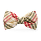 Plaid bow tie with red, green, and beige pattern on a white background