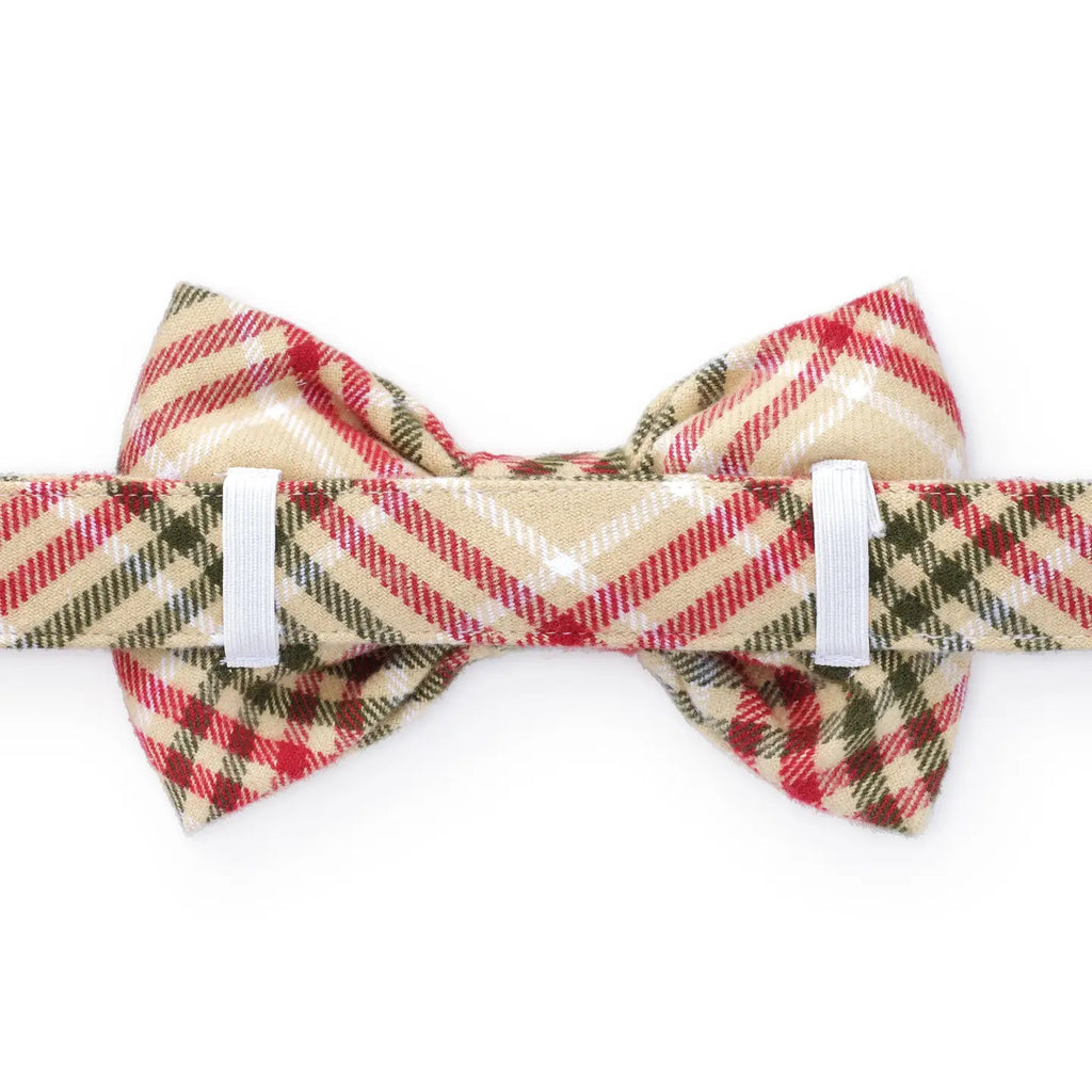 Plaid bow tie with red, beige, and green pattern on a white background