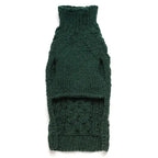 Underside of a wool green cable knitted dog sweater on a white background