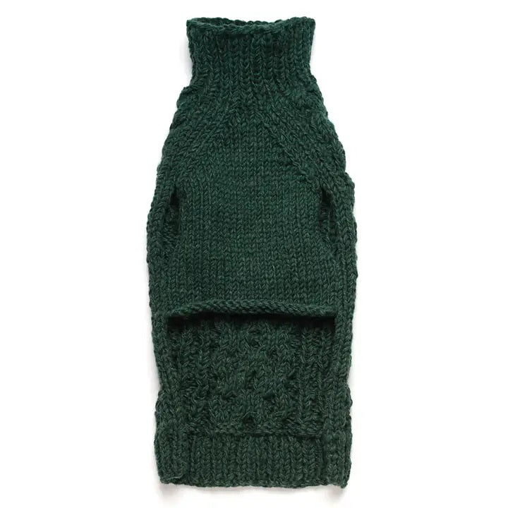 Underside of a wool green cable knitted dog sweater on a white background