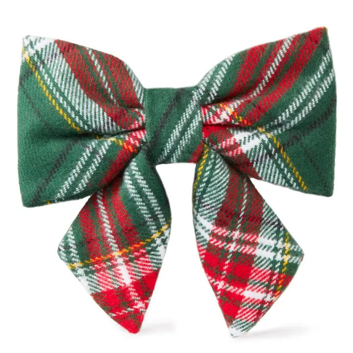 Plaid bow tie with green, red, and white pattern on a white background