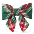 Plaid bow tie with green, red, and white pattern on a white background
